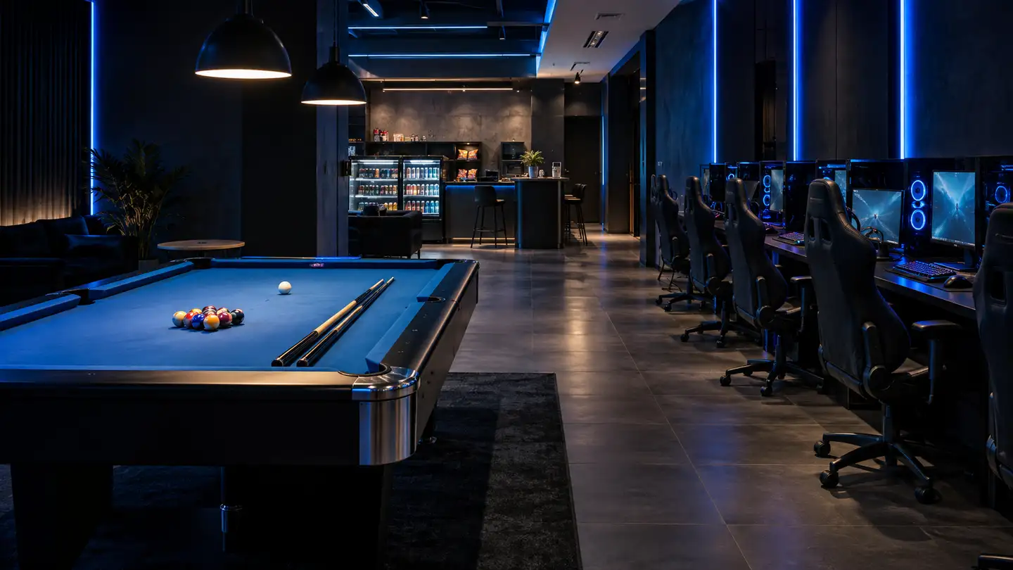 A gaming centre with PC stations, a billiards table and a refreshments counter